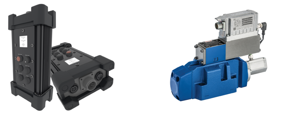 Pair of industrial servo components: left a tall black drive module with controls and circular connectors, right a blue hydraulic motor with valve block.