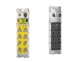 Two industrial control modules side by side: a yellow terminal block with multiple screw terminals and a gray module with circular connectors beneath.
