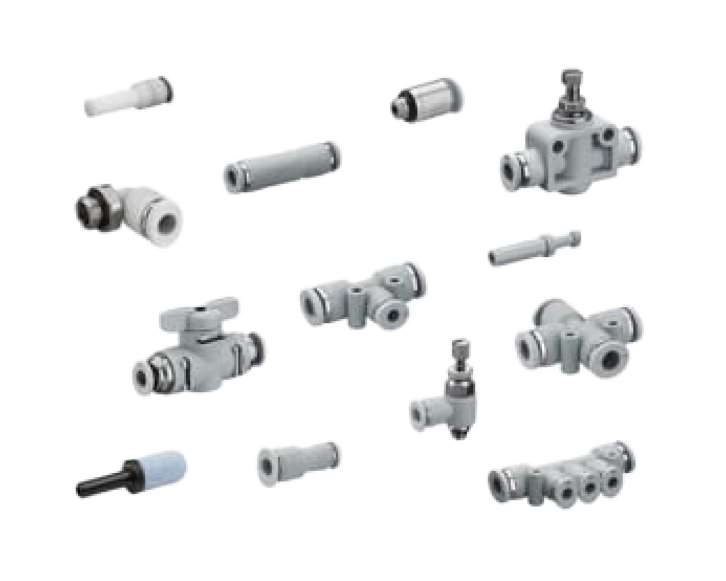 Collection of assorted plumbing fittings and valves (elbows, adapters, connectors) scattered on a black background